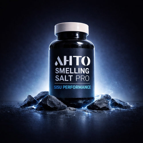 Bottle of 'AHTO Smelling Salt Pro' on a dark background with rocks.