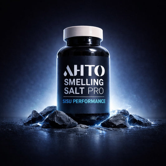 Bottle of 'AHTO Smelling Salt Pro' on a dark background with rocks.